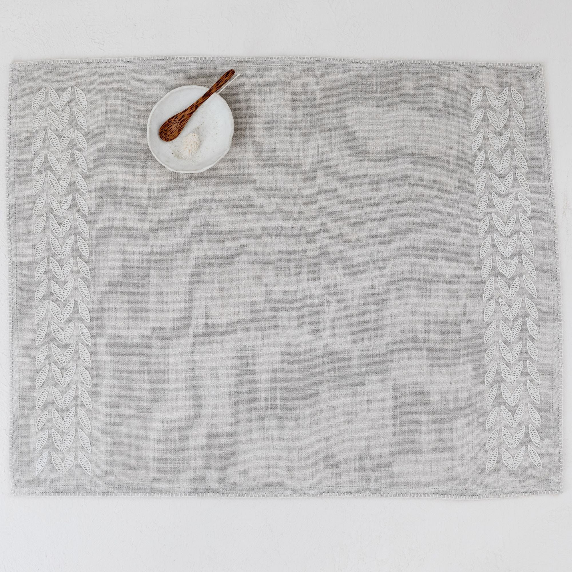 Beige linen placemat hand embroidered petal design by artha collections