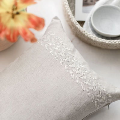 Rectangular beige linen throw pillow hand embroidered from artha collections