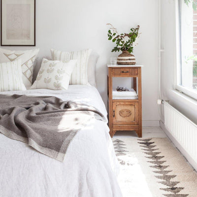 Cozy bedroom decor with wool area rugs from Artha Collections