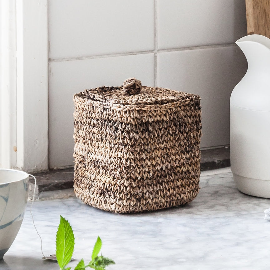 Small handwoven square storage basket with lid. Banana fiber baskets from Artha Collections