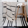 Bathroom decor with black and white stripe cotton bath towels and bath mat from artha collections