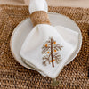 Cream linen cloth napkin with christmas tree design and tassel by artha collections