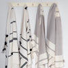 Handwoven cotton bath towels in grey and cream and black and cream by artha collections