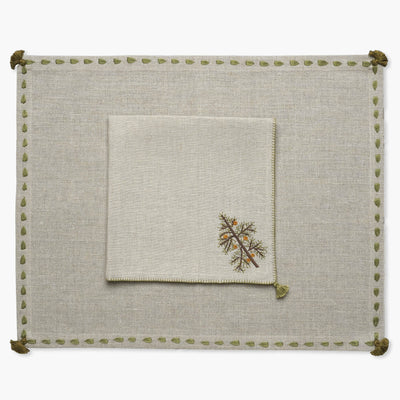 beige linen placemat hand embroidered green border wit matching napkin with christmas tree motif