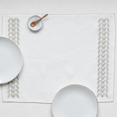 Cream linen placemat with petal design border by artha collections