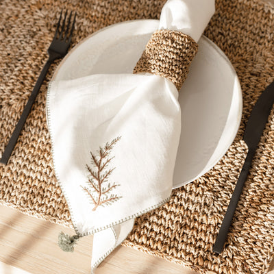 fern motif cream cloth napkin with tassel from artha collections