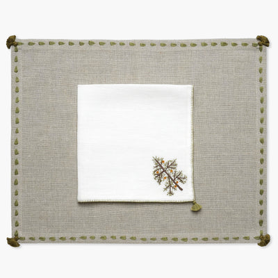 Beige linen hand embroidered placemat with green border and cream linen napkin with christmas tree  motif