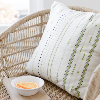 Linen throw pillow with hand embroidered lines design by artha collections
